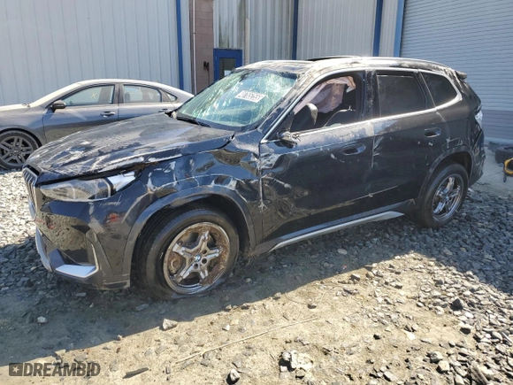 2025 BMW X1 xDrive28i with VIN WBX73EF00S5111795, listed as a Copart auction lot 48765255 with 12,042 mi miles and Salvage Title. Bid and sale history available at carsss.com. Image 1.