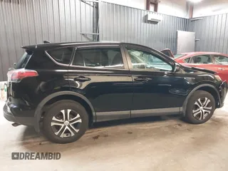 2018 Toyota RAV4 LE with VIN 2T3BFREV7JW768376, listed as a IAAI auction lot 41864571 with 292,147 mi miles. Bid and sale history available at carsss.com. Image 14.
