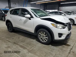2016 Mazda CX-5 Sport with VIN JM3KE4BY9G0694709, listed as a Copart auction lot 55147555 with 98,900 mi miles and Salvage title. Bid and sale history available at DreamBid. Image 4.