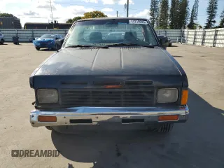 1986 Nissan Hardbody z VIN 1N6ND11S3GC381896, wystawiony jako Copart lot #44219045 z przebiegiem 124 009 mil mil oraz Szkody całkowita. Historia ofert i sprzedaży dostępna na DreamBid. Obrazek 5.