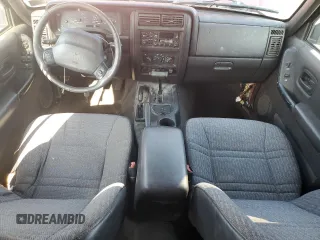 2000 Jeep Cherokee z VIN 1J4FF48S2YL135037, wystawiony jako Copart lot #66156505 z przebiegiem 72 433 mil mil oraz Szkoda całkowita • Salvage title. Historia ofert i sprzedaży dostępna na DreamBid. Obrazek 8.