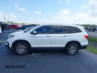 2020 Honda Pilot EX-L with VIN 5FNYF5H59LB028268, listed as a IAAI auction lot 42355620 with 107,033 mi miles and . Bid and sale history available at DreamBid. Image 14.