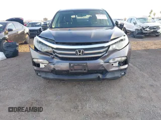 2017 Honda Pilot EX-L with VIN 5FNYF5H74HB010026, listed as a IAAI auction lot 41633770 with 170,383 mi miles and . Bid and sale history available at DreamBid. Image 6.