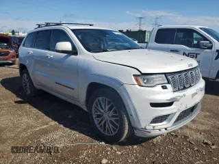 2017 Jeep Grand Cherokee Summit with VIN 1C4RJFJT9HC736624, listed as a Copart auction lot 62197245 with 217,469 mi miles and Salvage title. Bid and sale history available at DreamBid. Image 4.