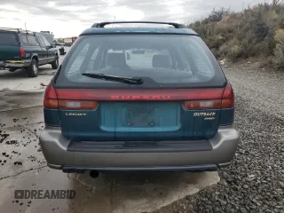 1996 Subaru Legacy Outback with VIN 4S3BG685XT7984194, listed as a Copart auction lot 77999224 with 130,804 mi miles and Salvage title. Bid and sale history available at DreamBid. Image 6.