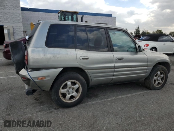 1999 Toyota RAV4 with VIN JT3GP10V0X7054819, listed as a Copart auction lot 44864015 with 140,095 mi miles and Salvage Title. Bid and sale history available at DreamBid. Image 3.