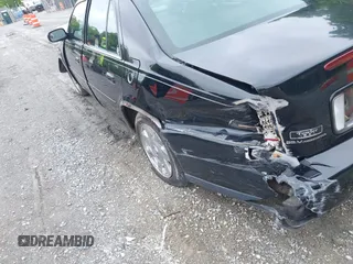 2002 Cadillac DeVille DTS z VIN 1G6KF579320288667, wystawiony jako IAAI lot #42331236 z przebiegiem 71 189 mil mil oraz . Historia ofert i sprzedaży dostępna na DreamBid. Obrazek 20.