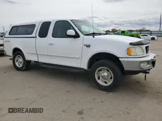 1998 Ford F-150 with VIN 1FTZX18W5WKB91459, listed as a Copart auction lot 52369095 with 185,660 mi miles and Salvage title. Bid and sale history available at DreamBid. Image 4.