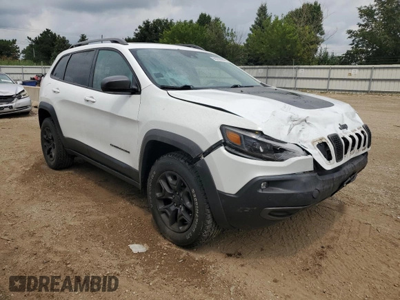 2019 Jeep Cherokee Trailhawk Elite with VIN 1C4PJMBX7KD140720, listed as a Copart auction lot 64268064 with 61,747 mi miles and Salvage Title. Bid and sale history available at carsss.com. Image 4.