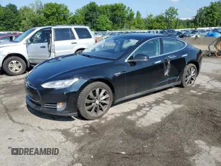 2014 Tesla Model S 60 with VIN 5YJSA1H16EFP49029, listed as a Copart auction lot 65151355 with 105,897 mi miles and Salvage title. Bid and sale history available at DreamBid. Image 1.