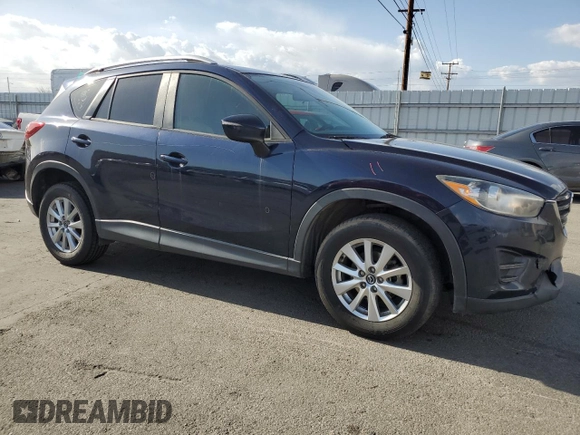 2016 Mazda CX-5 Sport with VIN JM3KE2BY0G0730906, listed as a Copart auction lot 51611865 with 207,166 mi miles and Salvage Title. Bid and sale history available at carsss.com. Image 4.