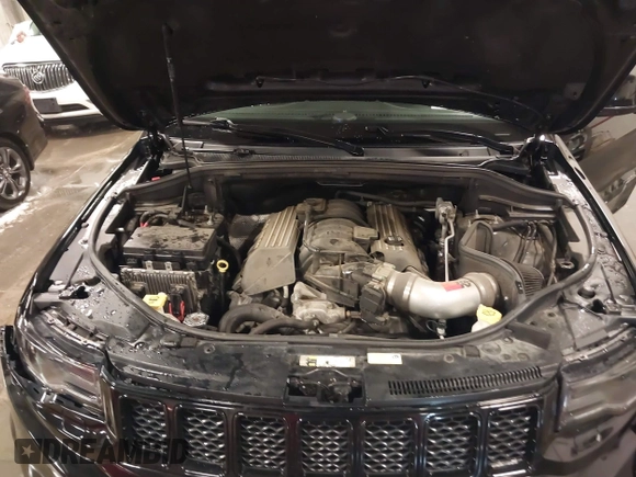 2017 Jeep Grand Cherokee SRT with VIN 1C4RJFDJ9HC739324, listed as a IAAI auction lot 40898998 with 92,547 mi miles. Bid and sale history available at carsss.com. Image 10.