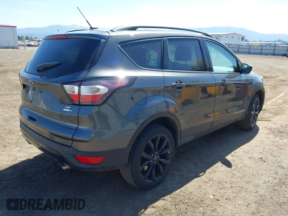 2017 Ford Escape SE with VIN 1FMCU9G94HUE80554, listed as a IAAI auction lot 42039491 with 57,145 mi miles. Bid and sale history available at carsss.com. Image 4.