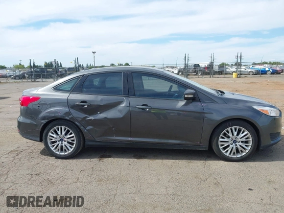 2018 Ford Focus SE z VIN 1FADP3F20JL327186, wystawiony jako IAAI lot #42271070 z przebiegiem 131 511 mil mil oraz . Historia ofert i sprzedaży dostępna na DreamBid. Obrazek 13.