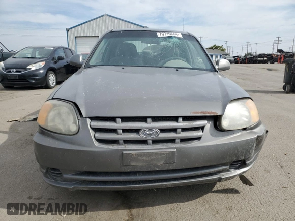 2004 Hyundai Accent GL with VIN KMHCG35C34U290855, listed as a Copart auction lot 70719664 with 176,210 mi miles and Salvage Title. Bid and sale history available at carsss.com. Image 5.