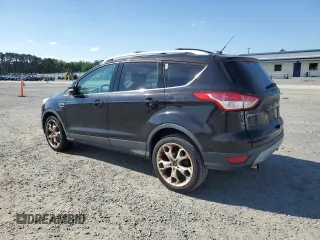 2013 Ford Escape Titanium z VIN 1FMCU0J93DUB60916, wystawiony jako Copart lot #61692595 z przebiegiem 169 691 mil mil oraz Szkoda całkowita • Salvage title. Historia ofert i sprzedaży dostępna na DreamBid. Obrazek 2.