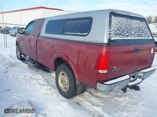 2000 Ford F-150 XL with VIN 1FTRX18WXYNC06121, listed as a IAAI auction lot 41340585 with 74,957 mi miles. Bid and sale history available at carsss.com. Image 3.