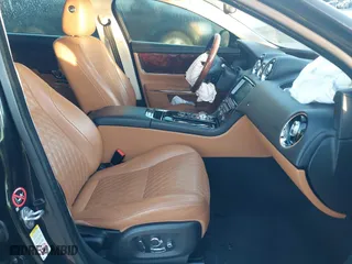 2018 Jaguar XJ with VIN SAJWJ2GD3J8W15092, listed as a IAAI auction lot 41844106 with 56,357 mi miles. Bid and sale history available at carsss.com. Image 5.