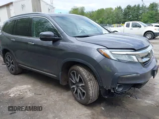 2021 Honda Pilot Touring 7-Passenger z VIN 5FNYF6H69MB005833, wystawiony jako IAAI lot #42299145 z przebiegiem 66 621 mil mil oraz . Historia ofert i sprzedaży dostępna na DreamBid. Obrazek 1.