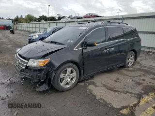 2011 Honda Odyssey Touring with VIN 5FNRL5H92BB037814, listed as a Copart auction lot 82138684 with 277,514 mi miles and Salvage title. Bid and sale history available at DreamBid. Image 1.