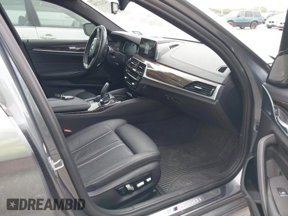 2018 BMW 5 Series M550i xDrive with VIN WBAJB9C55JB035694, listed as a IAAI auction lot 42122730 with 61,561 mi miles and . Bid and sale history available at DreamBid. Image 5.