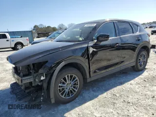 2021 Mazda CX-5 Touring with VIN JM3KFACM2M0443131, listed as a Copart auction lot 48559035 with 31,733 mi miles and Salvage Title. Bid and sale history available at carsss.com. Image 1.
