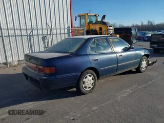 1994 Toyota Camry LE with VIN 4T1SK12EXRU374215, listed as a IAAI auction lot 41581093 with 80,397 mi miles. Bid and sale history available at carsss.com. Image 4.