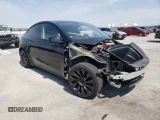 2023 Tesla Model Y Performance with VIN 7SAYGDEF9PF947667, listed as a Copart auction lot 52314795 with 40,634 mi miles and Salvage Title. Bid and sale history available at DreamBid. Image 4.