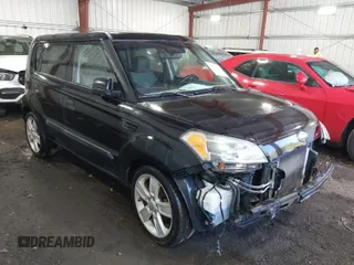 2010 Kia Soul + with VIN KNDJT2A21A7095510, listed as a IAAI auction lot 41879972 with 212,538 mi miles. Bid and sale history available at carsss.com. Image 1.