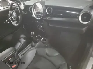 2012 MINI Coupe S z VIN WMWSX3C51CT408195, wystawiony jako Copart lot #77008744 z przebiegiem Nie podano mil oraz Szkody całkowita. Historia ofert i sprzedaży dostępna na DreamBid. Obrazek 8.
