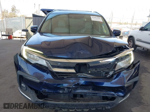 2019 Honda Pilot Touring 8-Passenger z VIN 5FNYF5H97KB013530, wystawiony jako IAAI lot #42403449 z przebiegiem 90 557 mil mil oraz . Historia ofert i sprzedaży dostępna na DreamBid. Obrazek 12.