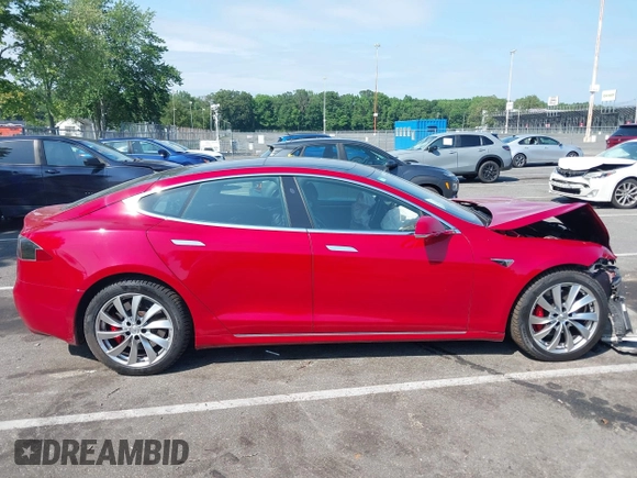 2016 Tesla Model S 90D z VIN 5YJSA1E4XGF171244, wystawiony jako IAAI lot #42584589 z przebiegiem 85 412 mil mil oraz . Historia ofert i sprzedaży dostępna na DreamBid. Obrazek 13.