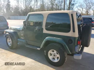 2000 Jeep Wrangler Sahara with VIN 1J4FA59S0YP795198, listed as a Copart auction lot 87920205 with 150,148 mi miles and Salvage Title. Bid and sale history available at carsss.com. Image 2.