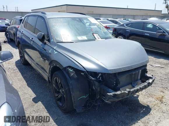 2023 Volkswagen Tiguan SE R-Line Black with VIN 3VV8B7AX3PM018096, listed as a IAAI auction lot 42174933 with 25,742 mi miles and . Bid and sale history available at DreamBid. Image 1.