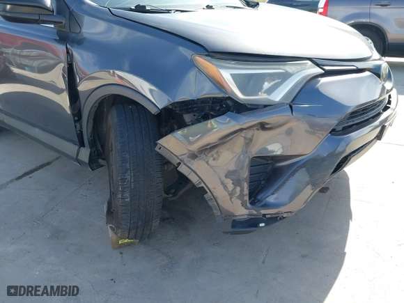 2018 Toyota RAV4 LE with VIN 2T3ZFREV4JW412661, listed as a IAAI auction lot 41781229 with 140,131 mi miles. Bid and sale history available at carsss.com. Image 6.