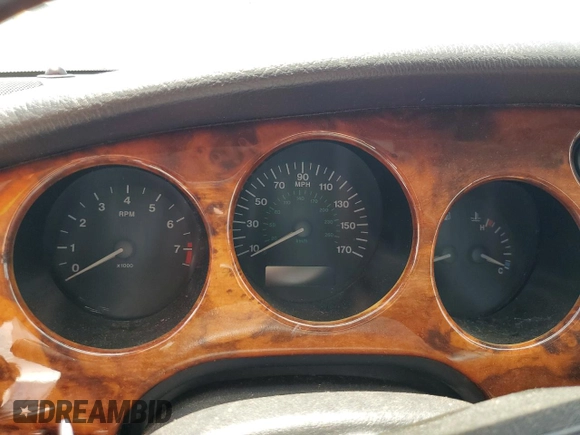 1999 Jaguar XK z VIN SAJGX2049XC034022, wystawiony jako Copart lot #55690025 z przebiegiem Nie podano mil oraz Tytuł czysty. Historia ofert i sprzedaży dostępna na DreamBid. Obrazek 9.