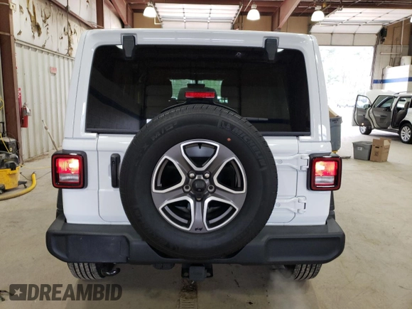 2023 Jeep Wrangler Willys with VIN 1C4HJXDNXPW618044, listed as a Copart auction lot 49214325 with 15,344 mi miles and Salvage title. Bid and sale history available at DreamBid. Image 6.