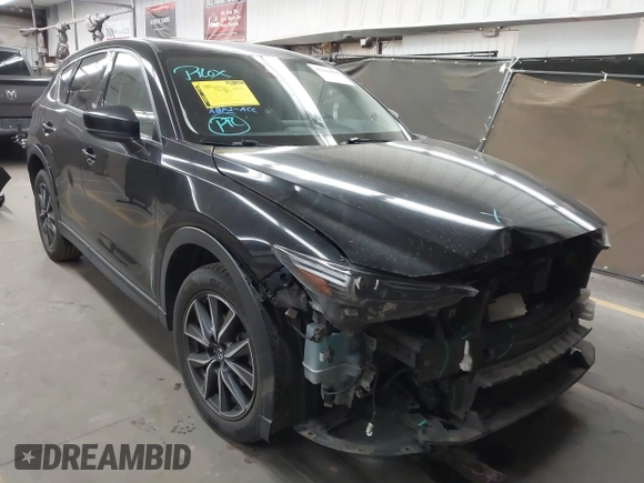 2018 Mazda CX-5 Grand Touring z VIN JM3KFADMXJ0311101, wystawiony jako IAAI lot #42163070 z przebiegiem 129 284 mil mil oraz . Historia ofert i sprzedaży dostępna na DreamBid. Obrazek 1.
