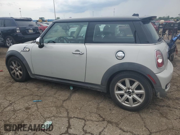 2011 MINI Hardtop S with VIN WMWSV3C58BTY11580, listed as a Copart auction lot 62081615 with 112,336 mi miles and Salvage title. Bid and sale history available at DreamBid. Image 2.