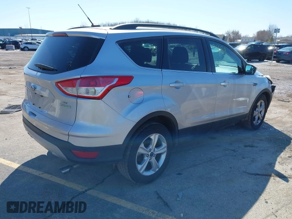 2014 Ford Escape SE with VIN 1FMCU0GX6EUE34729, listed as a IAAI auction lot 41879689 with 167,600 mi miles and . Bid and sale history available at DreamBid. Image 4.