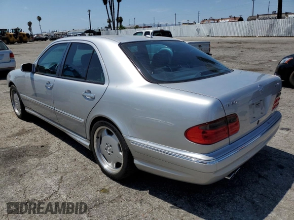 2000 Mercedes-Benz E with VIN WDBJF74J7YB055624, listed as a Copart auction lot 63880184 with 71,355 mi miles and Salvage Title. Bid and sale history available at DreamBid. Image 2.