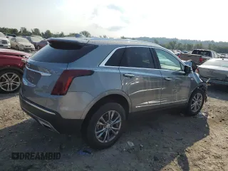 2023 Cadillac XT5 AWD Premium Luxury with VIN 1GYKNDR40PZ152982, listed as a Copart auction lot 69569914 with 24,829 mi miles and Salvage Title. Bid and sale history available at DreamBid. Image 3.