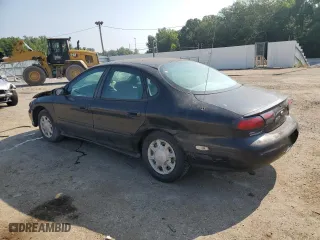 1998 Ford Taurus LX with VIN 1FAFP52U9WA174855, listed as a Copart auction lot 66728184 with 104,796 mi miles and Salvage Title. Bid and sale history available at carsss.com. Image 2.