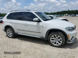 2012 BMW X5 35i с VIN 5UXZV4C58CL987049, выставлен на аукционе Copart как лот 61013925 с пробегом 167 508 миль миль и Чистый • Clean title. История ставок и продаж доступна на DreamBid. Изображение 4.