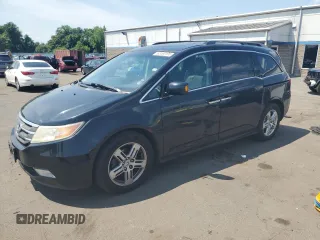 2012 Honda Odyssey Touring with VIN 5FNRL5H99CB100909, listed as a Copart auction lot 62460195 with 164,039 mi miles and Salvage title. Bid and sale history available at DreamBid. Image 1.