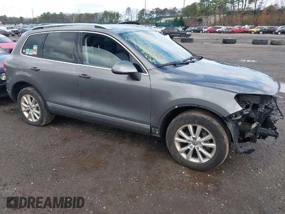 2013 Volkswagen Touareg Lux with VIN WVGEF9BPXDD000679, listed as a IAAI auction lot 41956471 with 117,465 mi miles and . Bid and sale history available at DreamBid. Image 1.