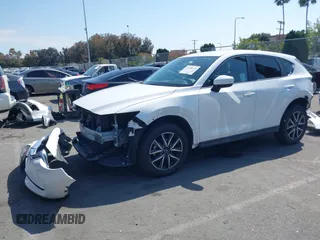 2018 Mazda CX-5 Touring with VIN JM3KFACM0J0416716, listed as a IAAI auction lot 42150121 with 61,332 mi miles and . Bid and sale history available at carsss.com. Image 18.