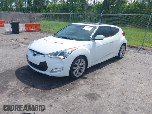 2012 Hyundai Veloster w/Gray Int z VIN KMHTC6ADXCU050034, wystawiony jako IAAI lot #42506584 z przebiegiem 142 514 mil mil oraz . Historia ofert i sprzedaży dostępna na DreamBid. Obrazek 2.