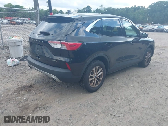 2021 Ford Escape SE with VIN 1FMCU9G60MUA38130, listed as a IAAI auction lot 42763003 with 98,388 mi miles and . Bid and sale history available at DreamBid. Image 4.