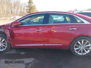 2014 Cadillac XTS Luxury z VIN 2G61N5S34E9163874, wystawiony jako IAAI lot #41649292 z przebiegiem 104 638 mil mil oraz . Historia ofert i sprzedaży dostępna na DreamBid. Obrazek 14.